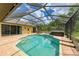 Outdoor pool with hot tub, brick patio, and covered screening at 127 Mill E Run, Bradenton, FL 34212