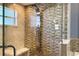 Modern shower with multiple body jets and a rainfall showerhead and glass door at 127 Mill E Run, Bradenton, FL 34212