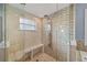 Modern walk-in shower with multiple showerheads and built-in bench at 127 Mill E Run, Bradenton, FL 34212