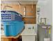 Functional utility sink and Rheem water heater in an organized utility space for household needs at 127 Mill E Run, Bradenton, FL 34212