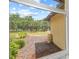 View from the window shows a pond, a lush backyard with well-maintained landscaping and green trees at 127 Mill E Run, Bradenton, FL 34212