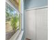 Window view to a manicured landscape, closet with folding doors and marble windowsill at 127 Mill E Run, Bradenton, FL 34212