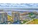 Beautiful aerial view showcasing the condos, marina, and waterfront location with lush landscaping and ample parking at 130 Riviera Dunes Way # 502, Palmetto, FL 34221