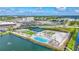 Aerial view of community including tennis courts, pools, and other facilities at 130 Riviera Dunes Way # 502, Palmetto, FL 34221