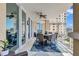Lovely outdoor balcony with ceiling fan and table/chairs overlooking the city at 130 Riviera Dunes Way # 502, Palmetto, FL 34221