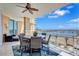 Inviting balcony with outdoor dining set and stunning waterfront views at 130 Riviera Dunes Way # 502, Palmetto, FL 34221