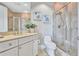 Well-lit bathroom with glass shower, a vanity with plenty of storage, and modern fixtures at 130 Riviera Dunes Way # 502, Palmetto, FL 34221