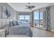 Serene bedroom featuring calming colors, a ceiling fan, and stunning views of the water at 130 Riviera Dunes Way # 502, Palmetto, FL 34221