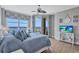 Comfortable bedroom showcasing a view of the water, and a flatscreen TV for entertainment at 130 Riviera Dunes Way # 502, Palmetto, FL 34221