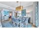 Chic dining area featuring a modern table setting, stylish lighting, and an open floor plan at 130 Riviera Dunes Way # 502, Palmetto, FL 34221