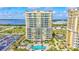 Exterior shot of a modern high rise apartment building with a pool at 130 Riviera Dunes Way # 502, Palmetto, FL 34221