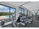 Bright fitness center featuring treadmills and stationary bike overlooking the pool at 130 Riviera Dunes Way # 502, Palmetto, FL 34221