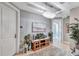 Elegant condo hallway featuring stylish decor, a decorative chandelier, and neutral colors at 130 Riviera Dunes Way # 502, Palmetto, FL 34221