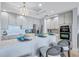 Bright kitchen featuring stainless steel appliances, counter seating, and modern lighting at 130 Riviera Dunes Way # 502, Palmetto, FL 34221