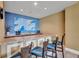 Cozy kitchenette area featuring granite countertops and wooden stools at 130 Riviera Dunes Way # 502, Palmetto, FL 34221