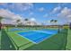 Outdoor tennis courts on a sunny day with a clear blue sky at 130 Riviera Dunes Way # 502, Palmetto, FL 34221