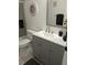 Bathroom featuring gray vanity, new fixtures, decorative mirror, and glass enclosed shower at 1414 58Th W St # 1414, Bradenton, FL 34209