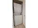 Efficiently designed laundry closet with a stacked washer and dryer unit, optimizing space in the home at 1414 58Th W St # 1414, Bradenton, FL 34209