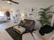 Inviting living room with sofa, chairs, ceiling fan, and access to dining area at 1414 58Th W St # 1414, Bradenton, FL 34209