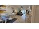 Bright living room with modern decor, flowing seamlessly into a dining area, perfect for entertaining guests at 1414 58Th W St # 1414, Bradenton, FL 34209