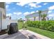 Charming backyard with a patio, well-maintained lawn, and lush landscaping at 15051 Ginetti St, Nokomis, FL 34275