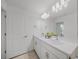 Bright bathroom offers a double sink vanity with quartz countertops and a large mirror at 15051 Ginetti St, Nokomis, FL 34275