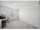 Neutral bedroom with carpet, a window with blinds, and an electrical outlet at 15051 Ginetti St, Nokomis, FL 34275