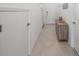 Hallway featuring neutral decor, tile flooring, and a closet at 15051 Ginetti St, Nokomis, FL 34275