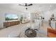 Inviting living area connects to a modern kitchen with sleek pendant lights and comfortable seating at 15051 Ginetti St, Nokomis, FL 34275