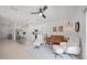 Spacious living room open to the kitchen with sleek ceiling fan and neutral color palette at 15051 Ginetti St, Nokomis, FL 34275