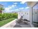 Private patio with modern seating and a view of the landscaped yard at 15051 Ginetti St, Nokomis, FL 34275