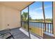 Relaxing balcony view featuring a lake and palm tree at 16804 Vardon Ter # 205, Bradenton, FL 34211