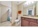 Bathroom boasts a tub and shower combo, toilet and granite vanity at 16804 Vardon Ter # 205, Bradenton, FL 34211