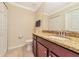 Half bathroom features granite countertops, a large mirror, and neutral paint at 16804 Vardon Ter # 205, Bradenton, FL 34211
