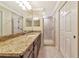 Bathroom features double vanity with granite counters and tiled walk-in shower at 16804 Vardon Ter # 205, Bradenton, FL 34211