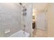 Bathroom shower with shower head and tiled walls near the vanity at 16804 Vardon Ter # 205, Bradenton, FL 34211