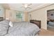 Comfortable bedroom with ceiling fan, dresser, and neutral colors at 16804 Vardon Ter # 205, Bradenton, FL 34211