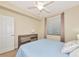Bedroom featuring neutral walls, a window, and a light blue comforter at 16804 Vardon Ter # 205, Bradenton, FL 34211