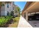 Walkways and landscaping surround this condo building and its convenient covered parking at 16804 Vardon Ter # 205, Bradenton, FL 34211
