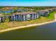Attractive condo building with screened patios, lush landscaping, and gorgeous waterfront views at 16804 Vardon Ter # 205, Bradenton, FL 34211