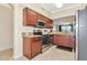 Stainless appliances, granite counter tops, and hardwood cabinets make a cozy kitchen at 16804 Vardon Ter # 205, Bradenton, FL 34211