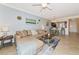 Inviting living and dining area showcases neutral decor and an open-concept layout at 16804 Vardon Ter # 205, Bradenton, FL 34211