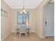 Bright office space features a modern desk, chair, and natural light from a window at 16804 Vardon Ter # 205, Bradenton, FL 34211