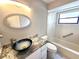 Stylish bathroom featuring modern vanity, sink, granite countertop, and shower-tub combo at 2204 34Th W St, Bradenton, FL 34205