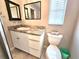 A bathroom with vanity, granite countertop, toilet and neutral walls at 2204 34Th W St, Bradenton, FL 34205