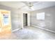Comfortable bedroom with tile floors, closet, ceiling fan and natural light at 2204 34Th W St, Bradenton, FL 34205