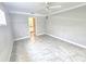 Neutral bedroom with tiled floors and access to ensuite bathroom at 2204 34Th W St, Bradenton, FL 34205