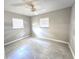 Bedroom with tile flooring, a ceiling fan and natural light coming from two windows at 2204 34Th W St, Bradenton, FL 34205