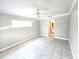 Bright, neutral bedroom features a ceiling fan and tiled floors at 2204 34Th W St, Bradenton, FL 34205