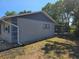 Exterior view showcasing the home's screened patio and well-kept lawn at 2204 34Th W St, Bradenton, FL 34205